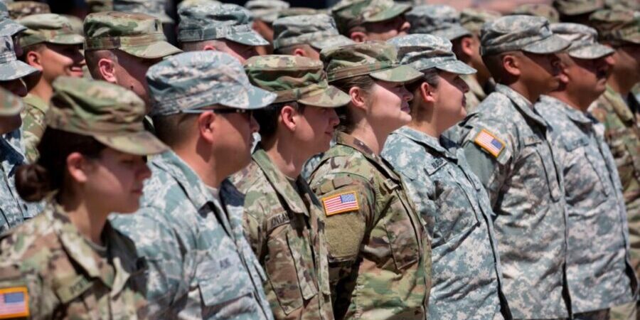 TOPSHOT - Members of the Arizona National Guard listen to instructions on April 9, 2018, at the Papago Park Military Reservation in Phoenix. - Arizona deployed its first 225 National Guard members to the Mexican border on Monday after President Donald Trump ordered thousands of troops to the frontier region to combat drug trafficking and illegal immigration. "The Arizona National Guard will deploy 225 members of the Guard today to support border security measures," the state militia said in a statement. (Photo by Caitlin O'Hara / AFP) (Photo credit should read CAITLIN O'HARA/AFP via Getty Images)